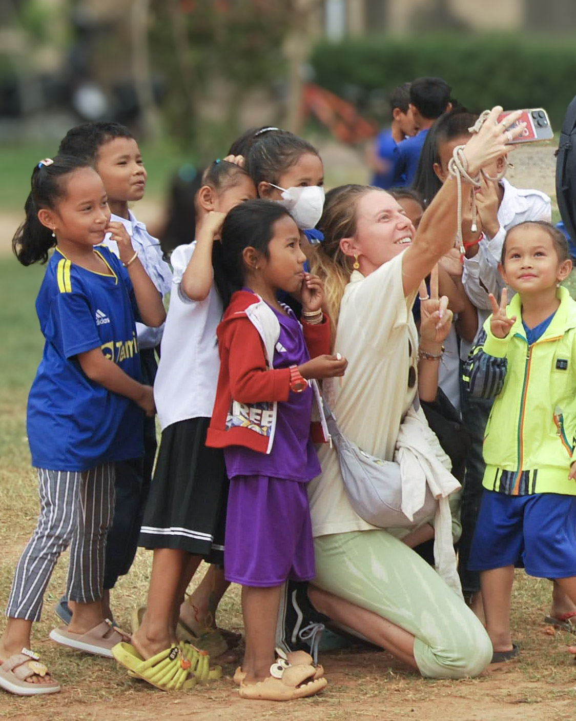Children laughing together beside their bicycles